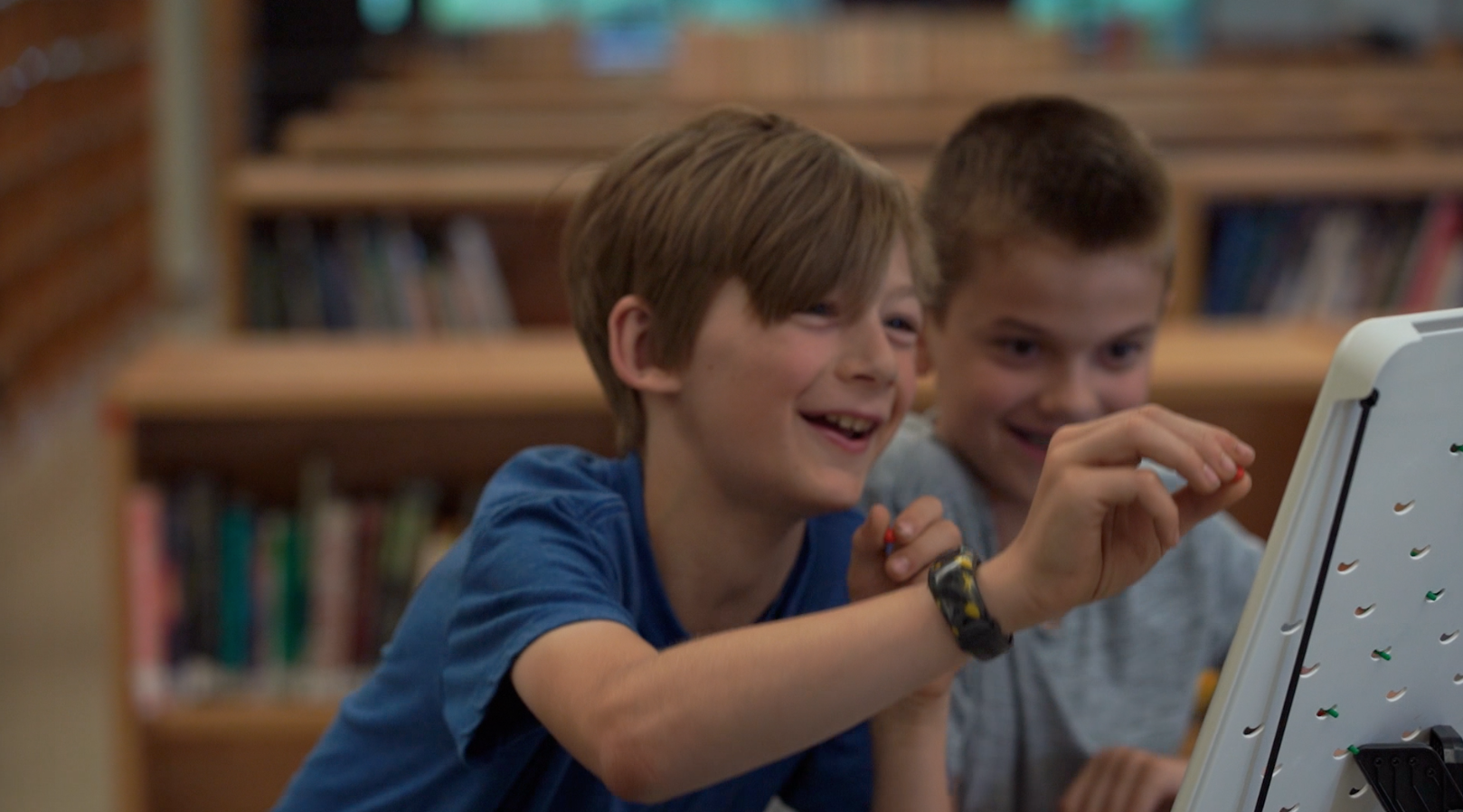 Photo of two children playing with Turing Tumble